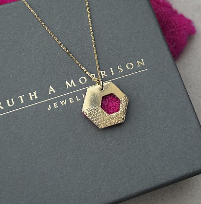 Yellow 9ct gold and Harris Tweed. Approx 20mm with an 18inch chain