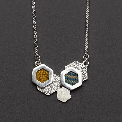 Sterling Silver, Harris Tweed. Approx 35x26mm with an 18inch chain.