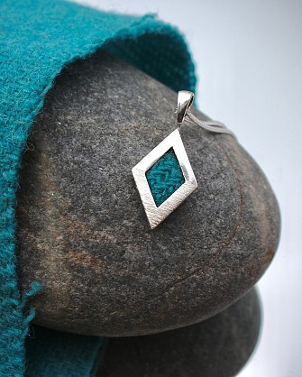 Sterling Silver, Harris Tweed. Approx 30x15mm with an 18inch chain.