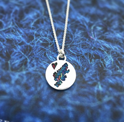 Sterling silver 18mm circular pendant with an 18inch chain.