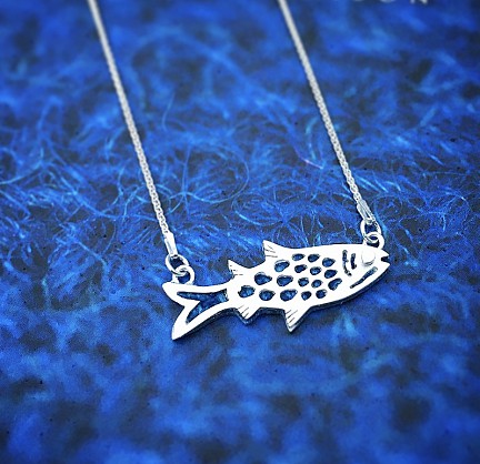 Sterling Silver and Harris Tweed- approx 40mm x 20mm with an 18inch chain 