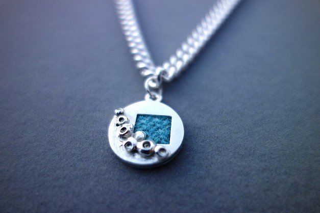 Sterling Silver - Harris Tweed. Approx 20mm round with an 5mm thick, 18inch chain
