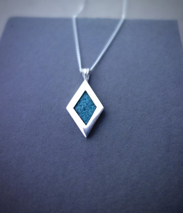 Sterling Silver, Harris Tweed. Approx 30x15mm with an 18inch chain.