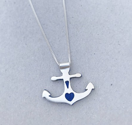 Sterling silver - approx 28x35mm with an 18inch chain 