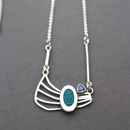 Sterling Silver - Harris Tweed and Tanzanite Stone. Approx 50x35mm with a 20mm chain